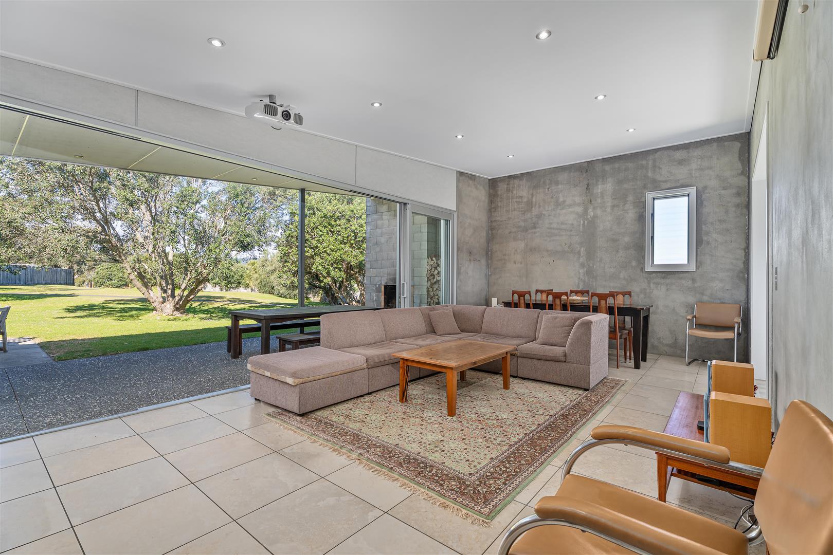 Living room with large doors opening to the garden